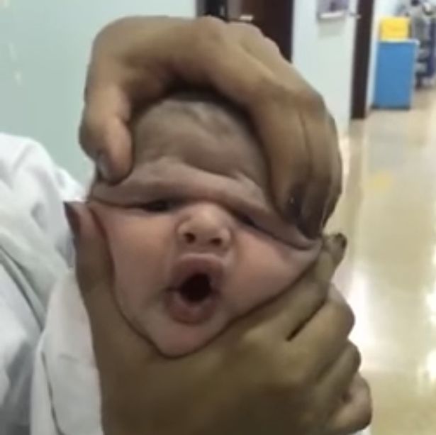 Woman gives blowjob while feeding baby