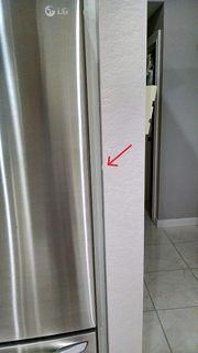 Refrigerator door stop swinging open